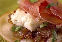 Pizzettes with Caramelized Onions, Goat Cheese, and Prosciutto