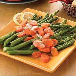 dill butter tops a vegetable medley of fresh asparagus and carrots.